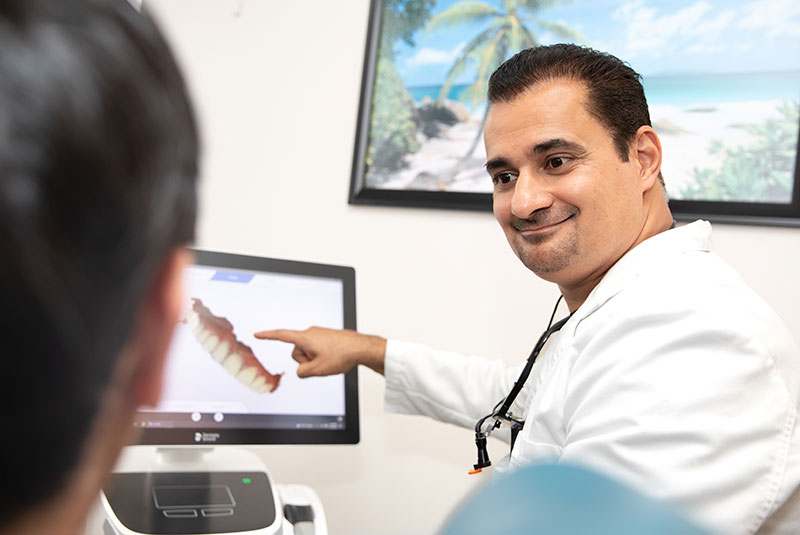 Doctor going over 3d scan of Patients teeth