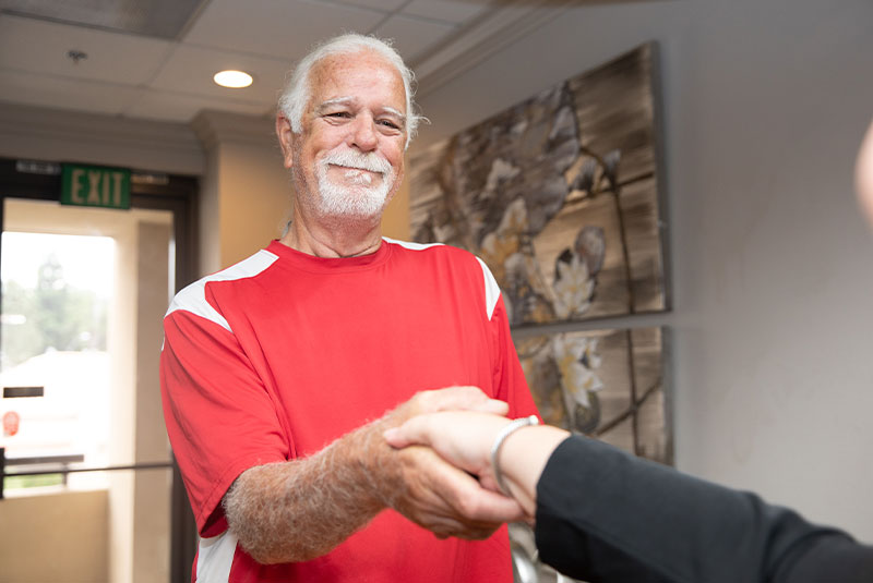 Patient Shaking team member hand