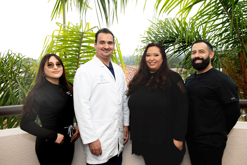 Doctor and his team smiling