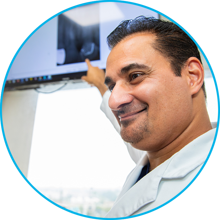 Doctor Pointing at dental x-ray