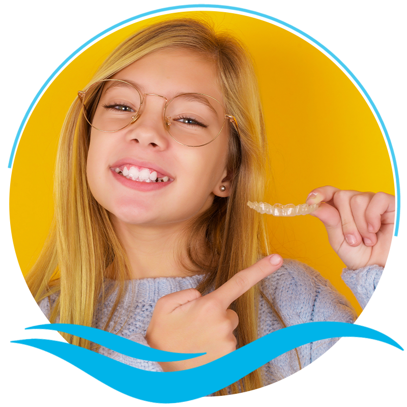 Child holding invisalign