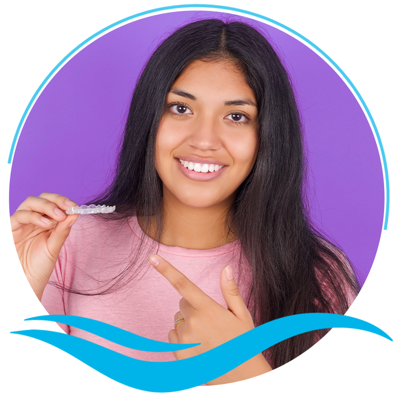 Girl holding Invisalign